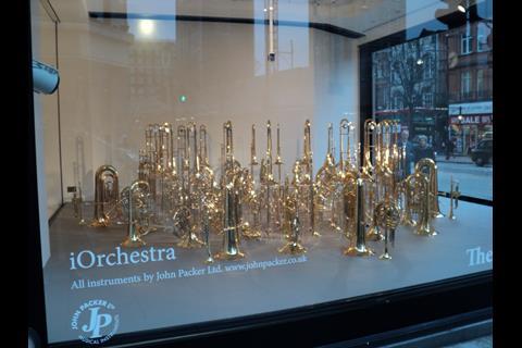 The four windows that front the store’s “Wonder Room” have a series of curious ‘installations.